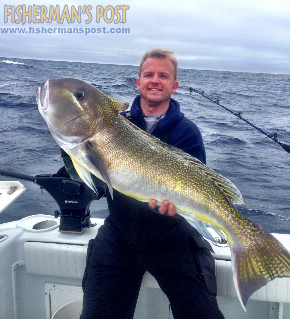 Capt. Barrett McMullan, of the Ocean Isle Fishing Center, with a golden tilefish he landed while deep-dropping in 500' of water 80 miles off Shallotte Inlet.