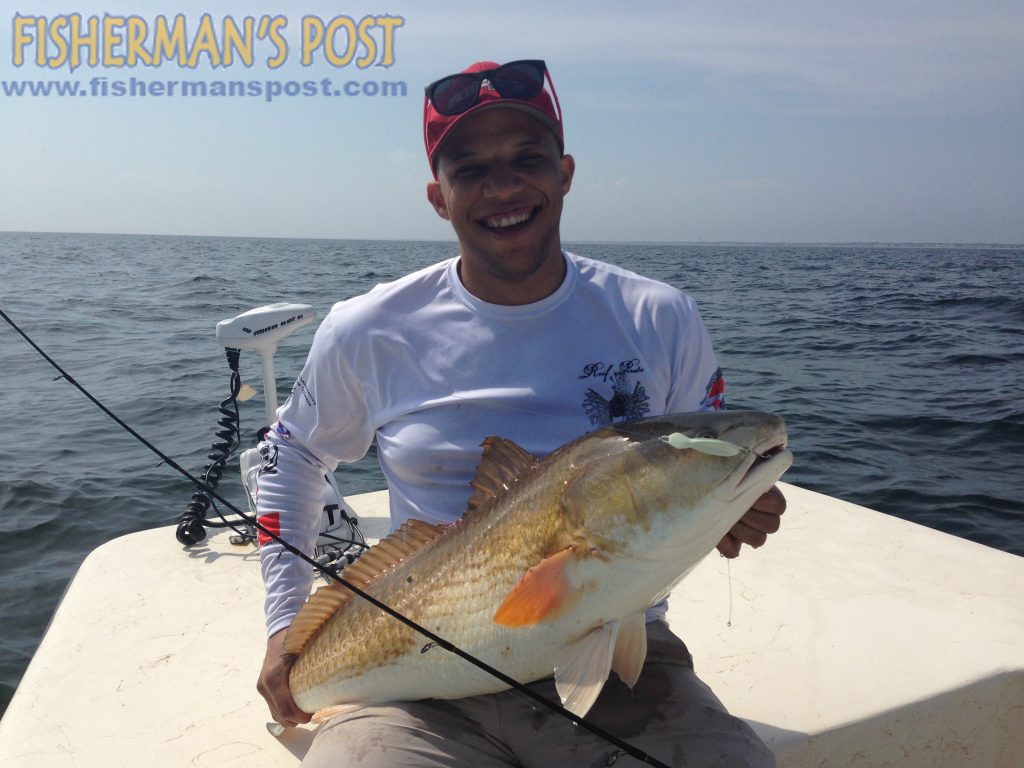 Blake Scott, of Wilmington, with a 38" red drum he caught and released just off Oak Island after it struck a 2 oz. Blue Water Candy Roscoe jig.