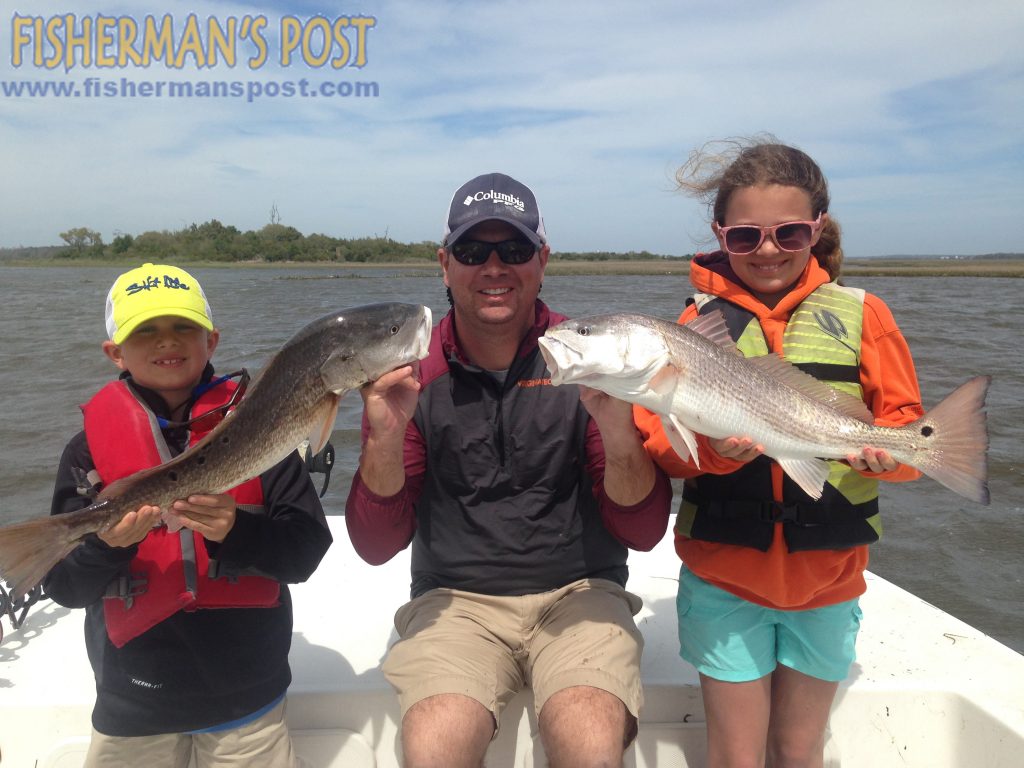 Evan, Anthony, and Alaina Miller, of Richmond, VA, with a pair of upper-slot red drum they landed while soaking cut mullet near some oyster rocks off Bogue Sound. They were fishing with Capt. Rob Koraly of Sandbar Safari Charters.