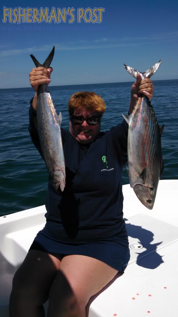 Alice Kline, of Southport, with a spanish mackerel and her first Atlantic bonito, hooked while trolling Clarkspoons just off Fort Fisher.