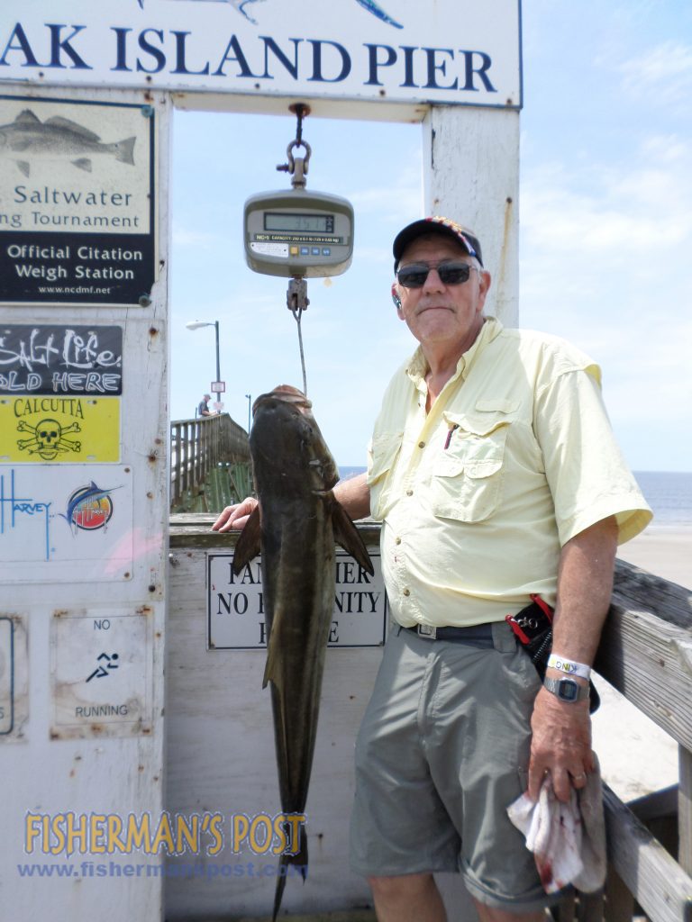 Don Davis, of Supply, NC, with a 35 lb., 5 oz. cobia that struck a live bluefish off the end of Oak Island Pier.