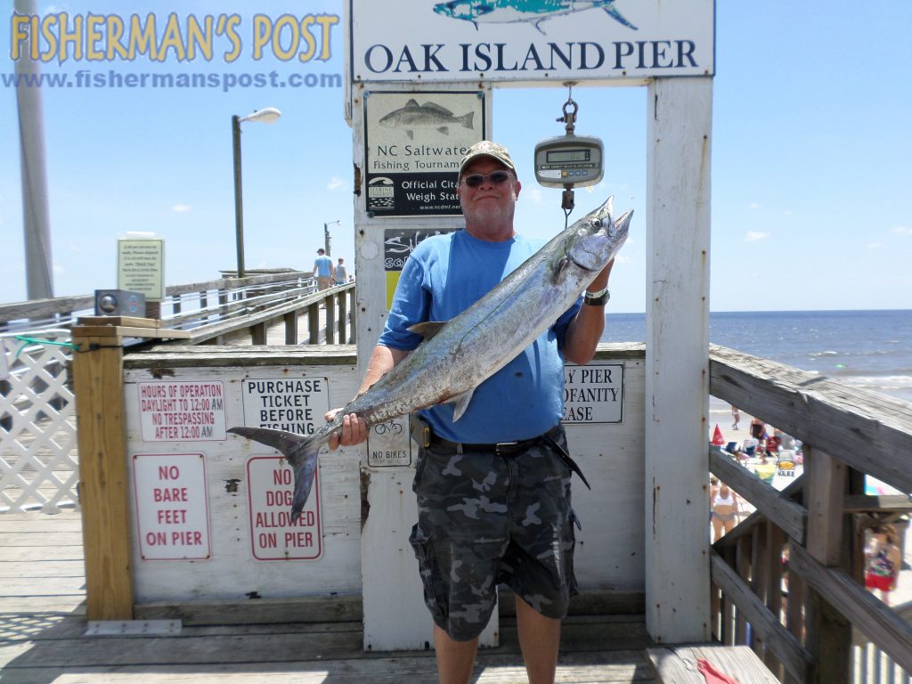 Rusty Wilson, of Asheboro, NC, with a 24.5 lb. king mackerel that bit a live bluefish off Oak Island Pier.