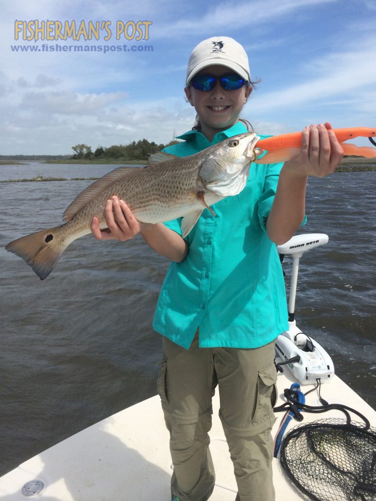 Sarah Smith with a red drum that struck a weedless Gulp bait in a marsh behind Bear Island while she was fishing with Capt. Jonathan Garrett of On Point Fishing Charters.