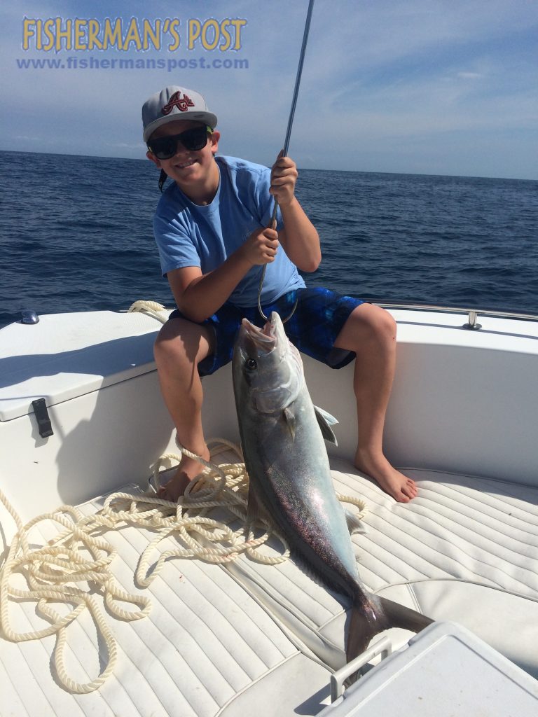 Dylan French with an amberjack he hooked on a live pinfish while grouper fishing 17 miles off New Topsail Inlet with his father David.