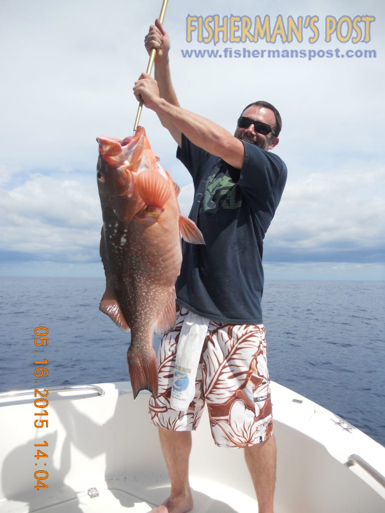 Rodney Williams with a red grouper that bit a cut bait in 125' of water off New River Inlet while he was fishing with David Cavenaugh and Harry T. Fisler.