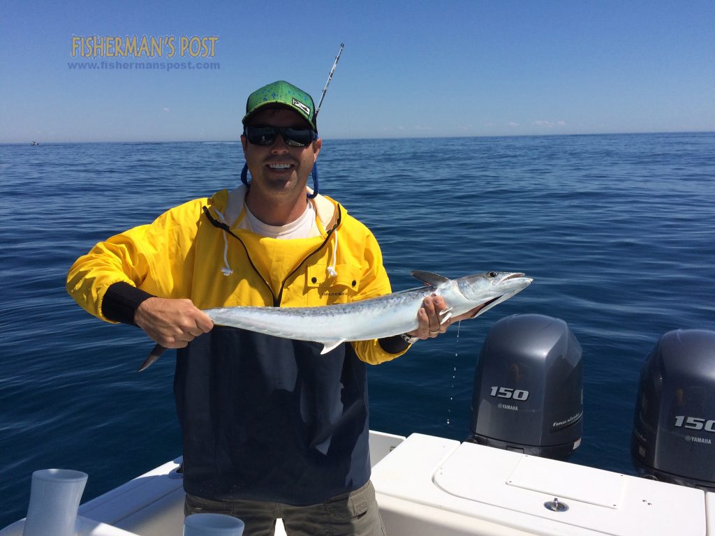 Brian Bellamy with a king mackerel that he landed while trolling 10 miles of Wrightsville Beach with Don Bellamy.