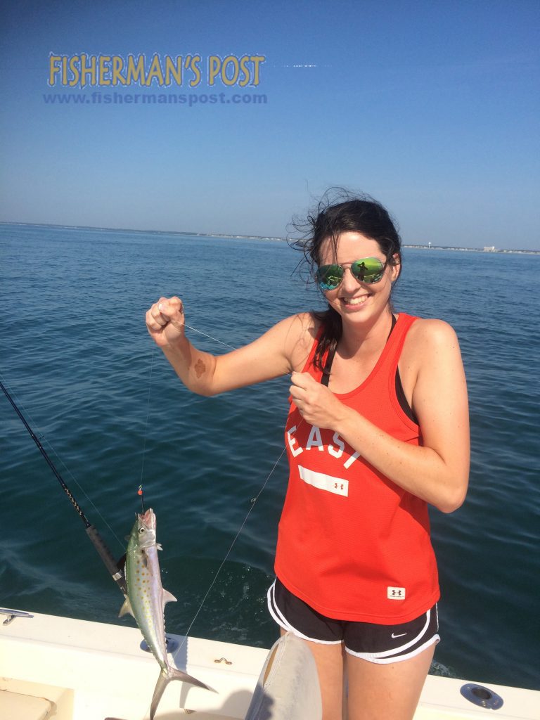 Jessica Tinney, of Wilmington, with her first fish, a spanish mackerel that bit a #0 Clarkspoons in 50' of water off Wrightsville Beach while she was fishing with Chandler Turlington.