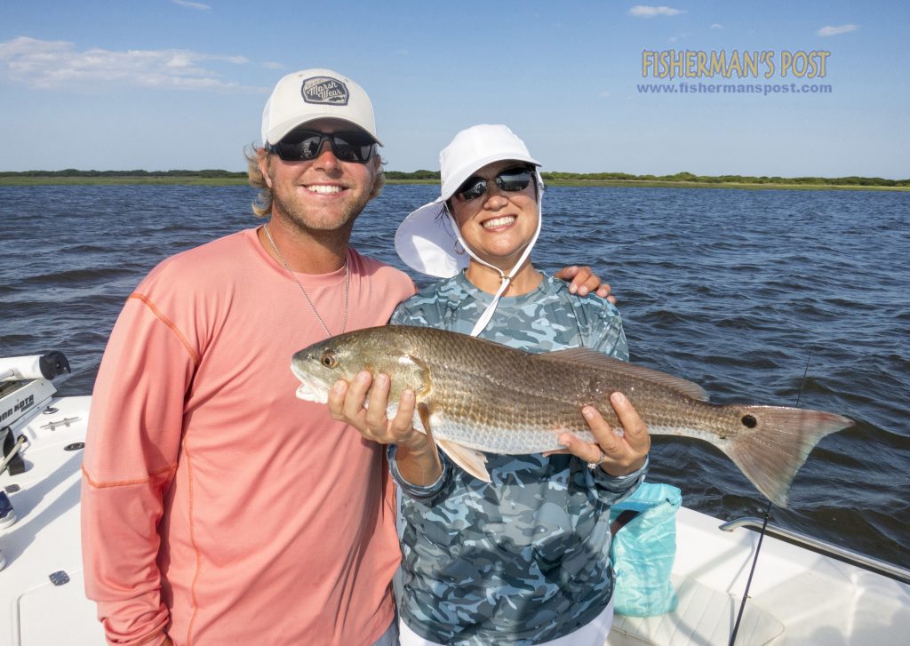 Capt. Christian Wolfe, of Seahawk Inshore Fishing Charters, and Peg Meddaugh, from Wilmington, with a red drum Peg landed in Buzzards Bay off the Cape Fear River. A live mud minnow fooled the drum.