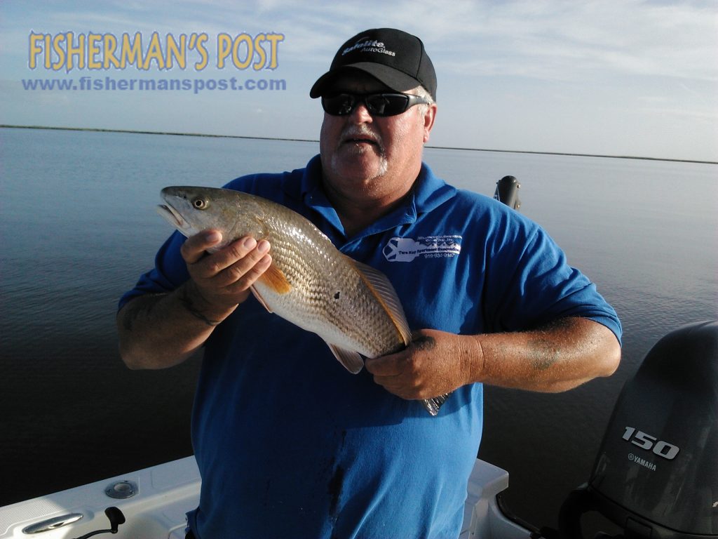 Jerry Marshall, Sr., of Kenly, NC, with a puppy drum that struck a D.O.A. soft plastic under a popping cork in the lower Neuse River while he was fishing with Capt. Gary Dubiel of Spec Fever Guide Service.
