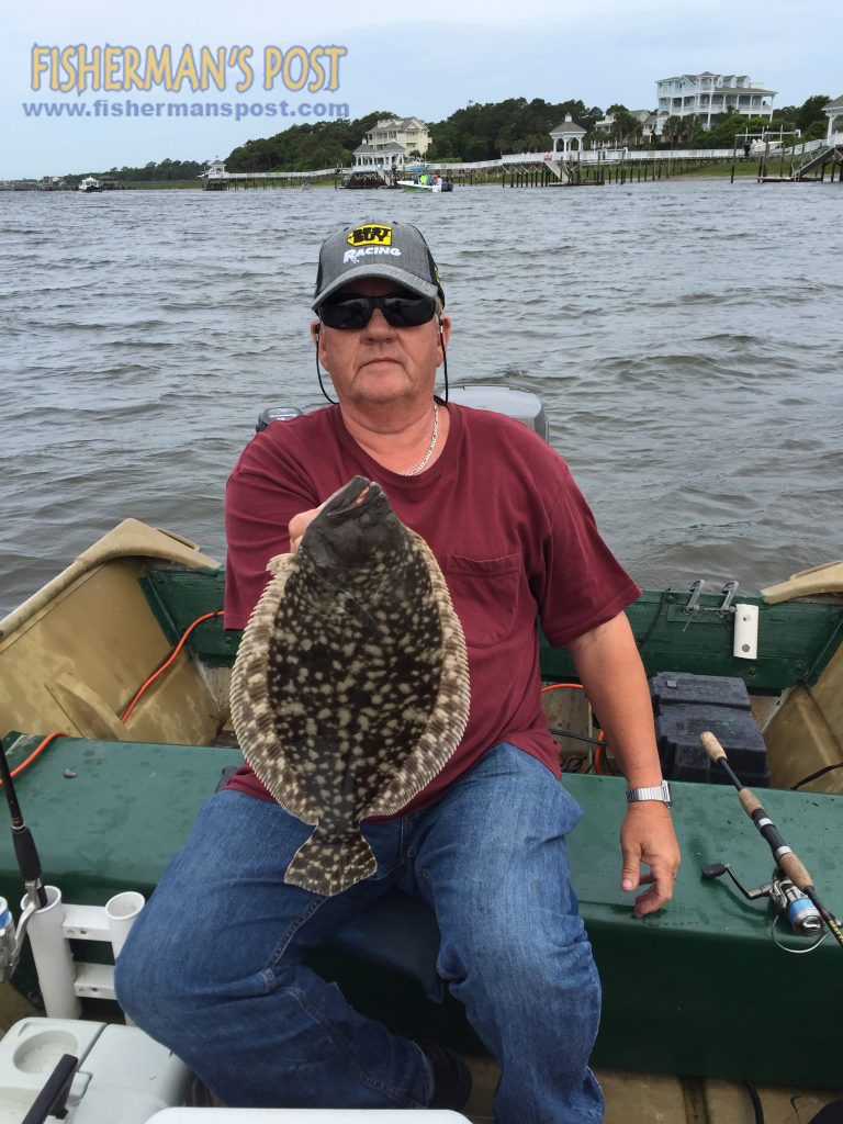 Ronnie Robbins, of Winnabow, NC, with a flounder that attacked a Gulp bait in Lockwood Folly Inlet.