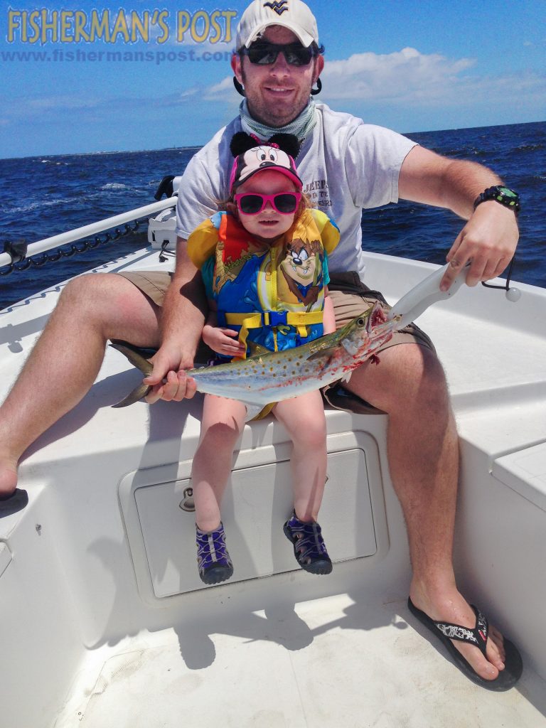 Richard and Scarlett (age 2) Domanski with Scarlett's first fish, a spanish mackerel that attacked a casting jig off Oak Island.