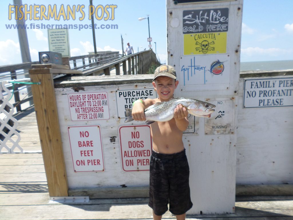 Michael Mendez (age 8), of Southport, with his first speckled trout, a 2.8 lb. fish that bit a live shrimp off Oak Island Pier.