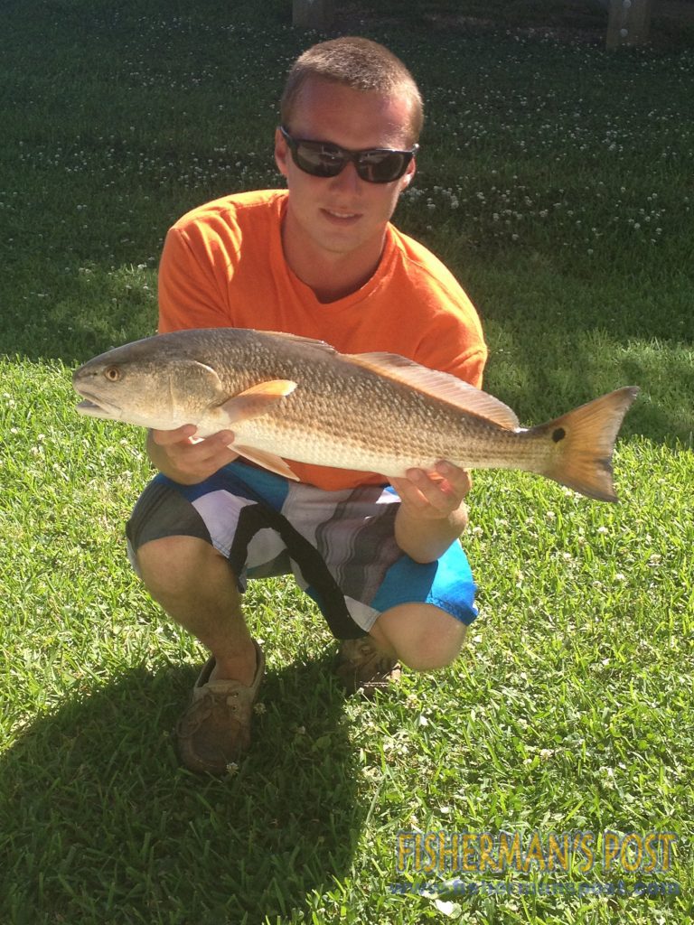 Daniel Lucas with a 26" red drum that struck a live bait beneath a popping cork near Sneads Ferry.