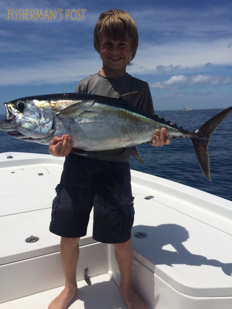 Luke Dudley with a 24 lb. blackfin tuna he landed while fishing 25 miles off Wrightsville Beach with his father Parker.