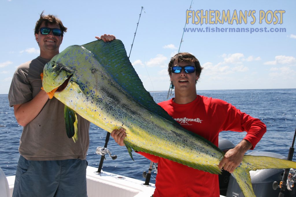 John Squire and Brody Brown with a 55.5 lb. dolphin they landed after it struck a Black Bart Tuna Candy at the Same Ol' Hole.