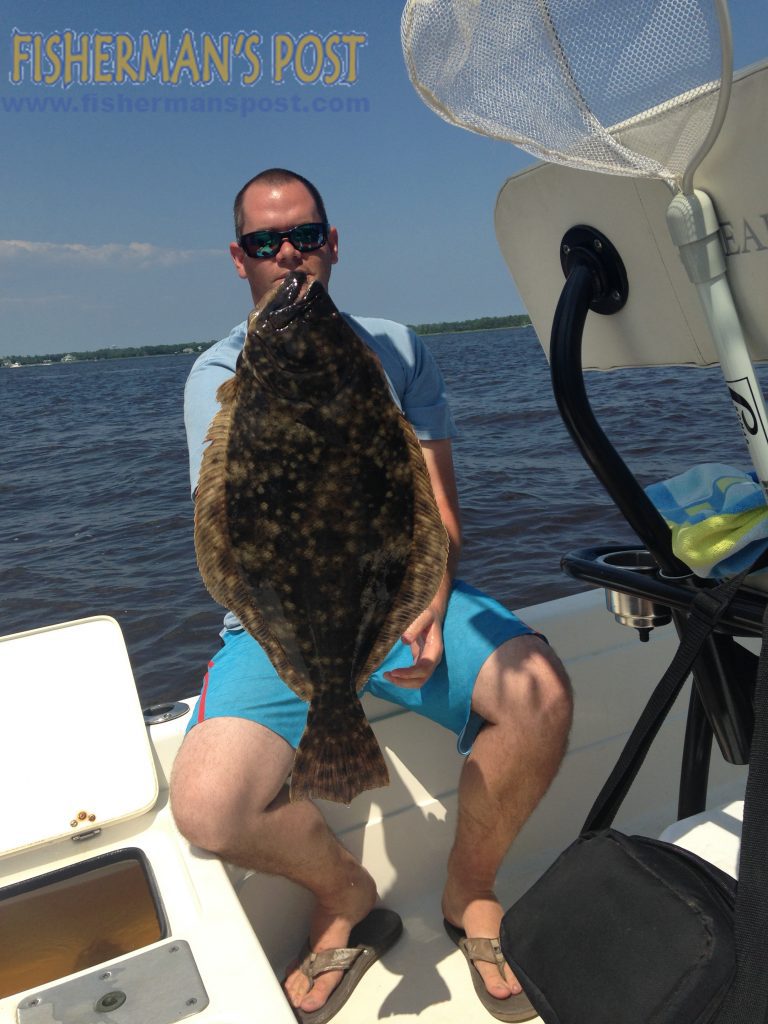 Devin Anderson with a 6.4 lb. flounder that engulfed a live menhaden in the Cape Fear River.