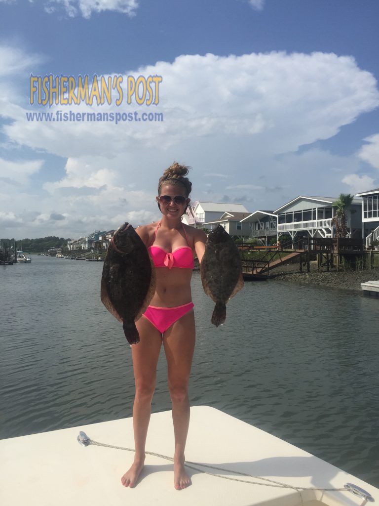 Hunter Simpson, of Elon, NC, with a pair of flounder she landed while fishing with her family in Shallotte Inlet.