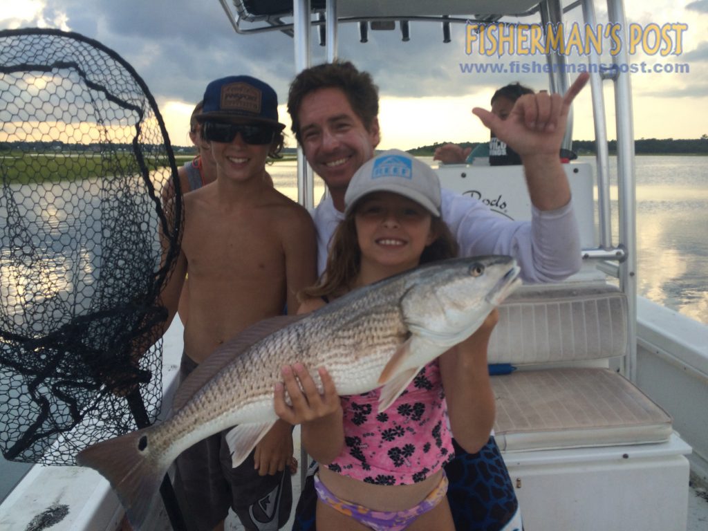 Ruby Conner with a 26" red drum that she hooked on a live finger mullet while fishing near Swansboro with her brothers Jack and Curren and parents John and Carrie.