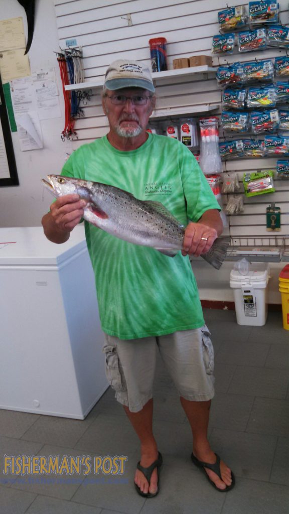 Richard Walton with a 4.7 lb. speckled trout that bit a live shrimp underneath a float while he was fishing from Seaview Pier.