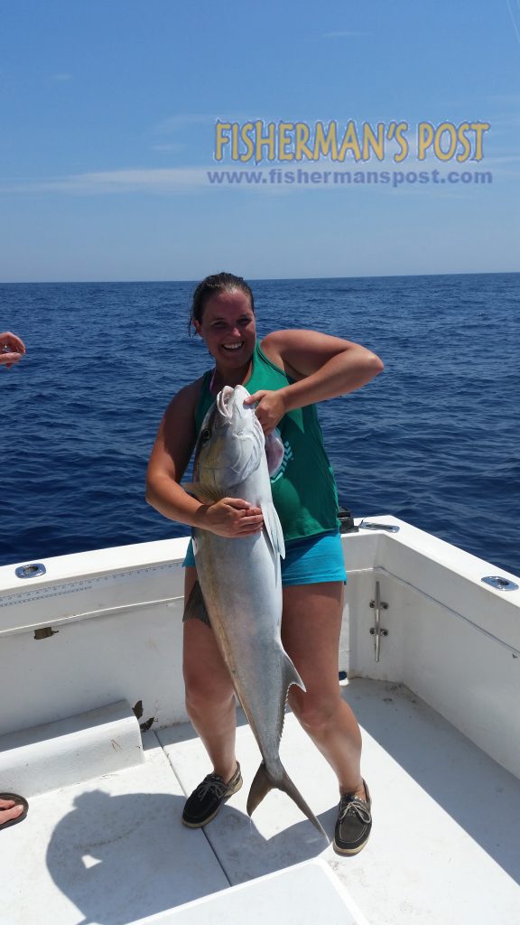 Mary Lanier with an amberjack that bit a Ballyhood Mahi Snagger as she was trolling 30 miles SE of Wrightsville Beach with her boyfriend Michael Gray.