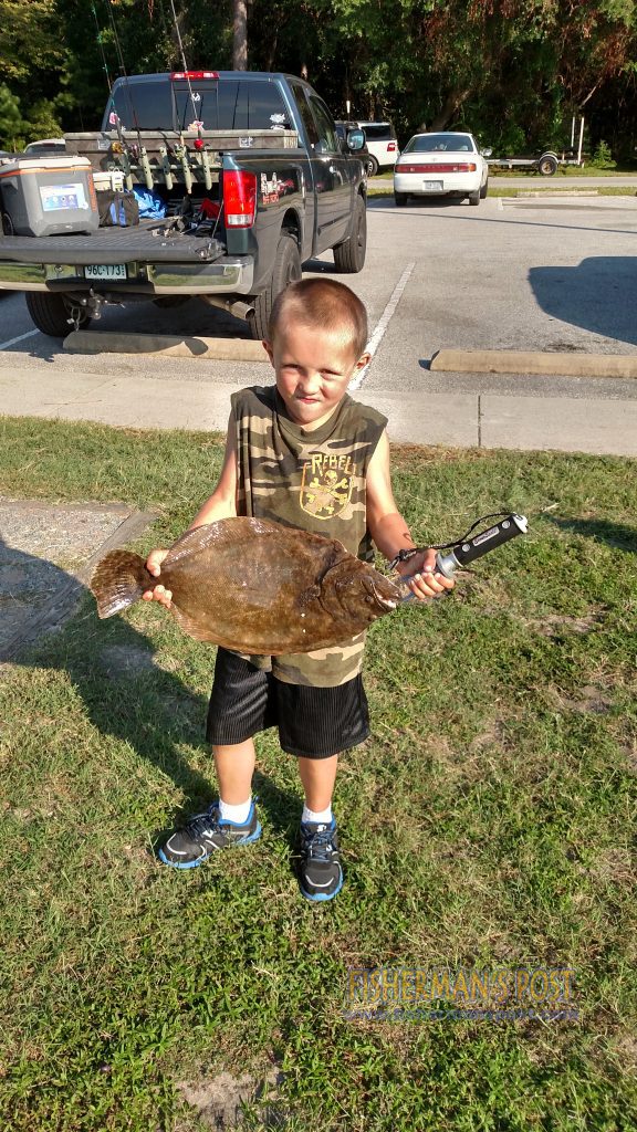 Connor Dimauro (age 6), with his largest flounder, a 4 lb., 14 oz. fish he hooked while fishing at Carolina Beach State Park.