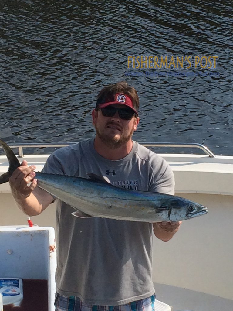 Ashley Spence, of Carolina Beach, NC, with an 8 lb., 2 oz. spanish mackerel that he hooked on a live bait near Carolina Beach Inlet.