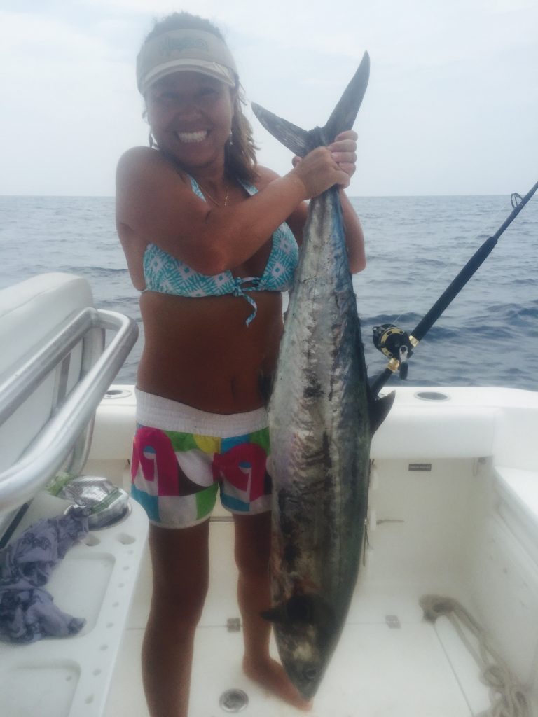 Anne Fenwick, of Swansboro, NC, with a 28 lb. king mackerel that bit a live menhaden while she was fishing off Ocean Isle Beach.