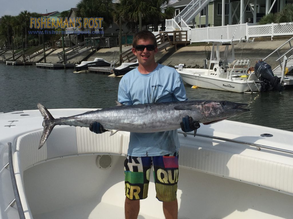 Holden Carroll with a 48 lb. wahoo he landed while trolling the Winyah Scarp aboard the "Pharmasea."