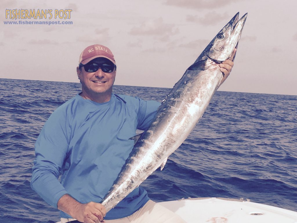 Edwin Newell with a 35 lb. wahoo that bit a ballyhoo under a blue/white Iland Lure while he was trolling around the Winyah Scarp with Bob Newell on the "Retriever."