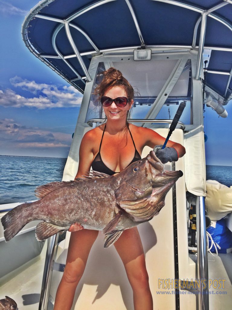 Crystal Babson with a snowy grouper that she hooked on squid while fishing in 700' of water 85 miles off Ocean Isle Beach with Daniel Simmons on the "Reel McCoy."