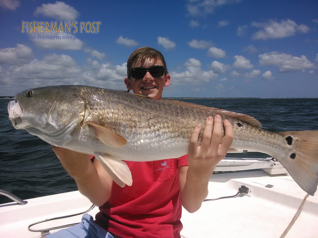 Lewis Player, of Fayetteville, NC, with an over-slot red drum that struck a live bait near Oak Island while he was fishing with Capt. Greer Hughes of Cool Runnings Charters.