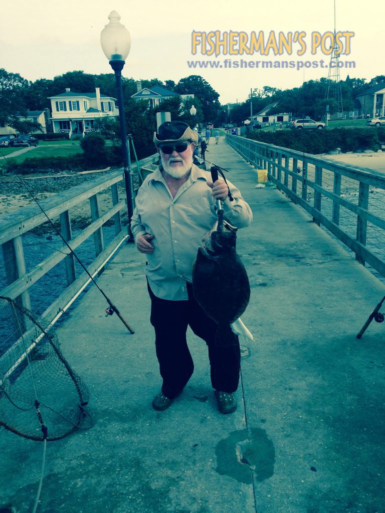 Harvey Suerken with an 8 lb. flounder he hooked while fishing the Southport waterfront.