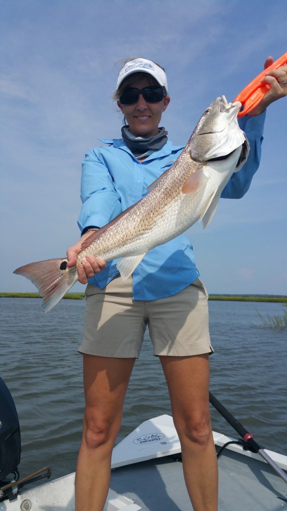 Danielle Bullock, of Wilmington, NC, with a 26.5" red drum she hooked on cut mullet while fishing near Swansboro with Capt. Dale Collins of Fish or Die Charters.