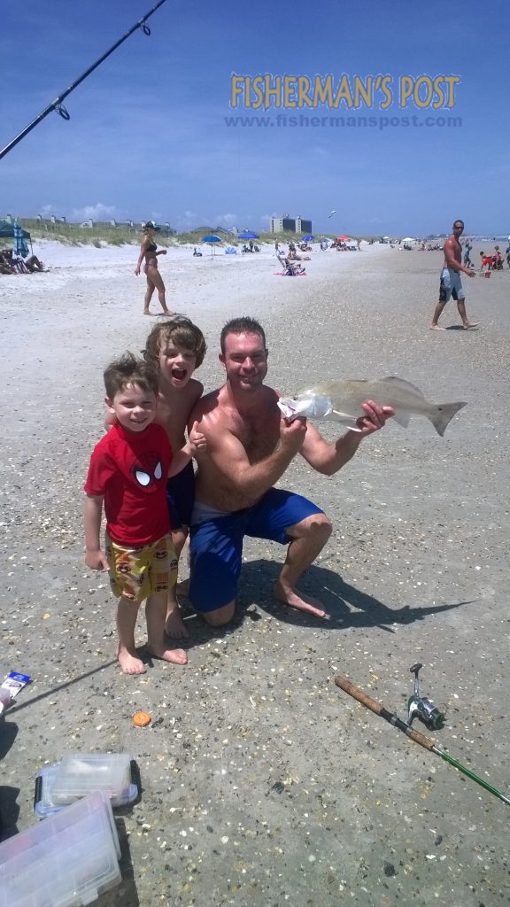 Matt, Rider, and Henry Brenneman, of Wilmington, NC, with a 27" red drum they caught and released while surf fishing at Wrightsville Beach. The red fell for a live finger mullet.