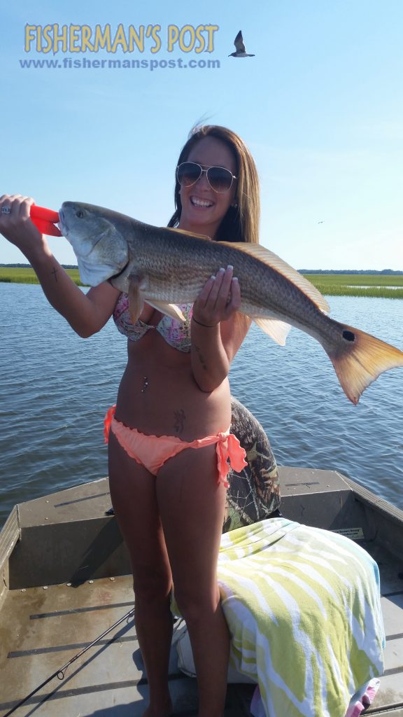 Kaitlyn Favolise with her first over-slot red drum, a 29" fish she caught and released while fishing with her boyfriend Kyle Peters near Southport. A Carolina-rigged finger mullet fooled the red.