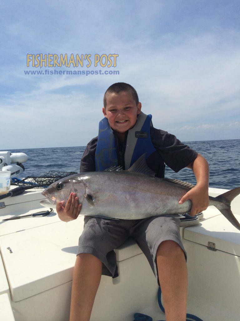 Adrian Sewell with his first amberjack, a 25 lb. fish that struck a live menhaden 10 miles off Bogue Inlet while he was fishing with Capt. Jonathan Garrett of On Point Fishing Charters.