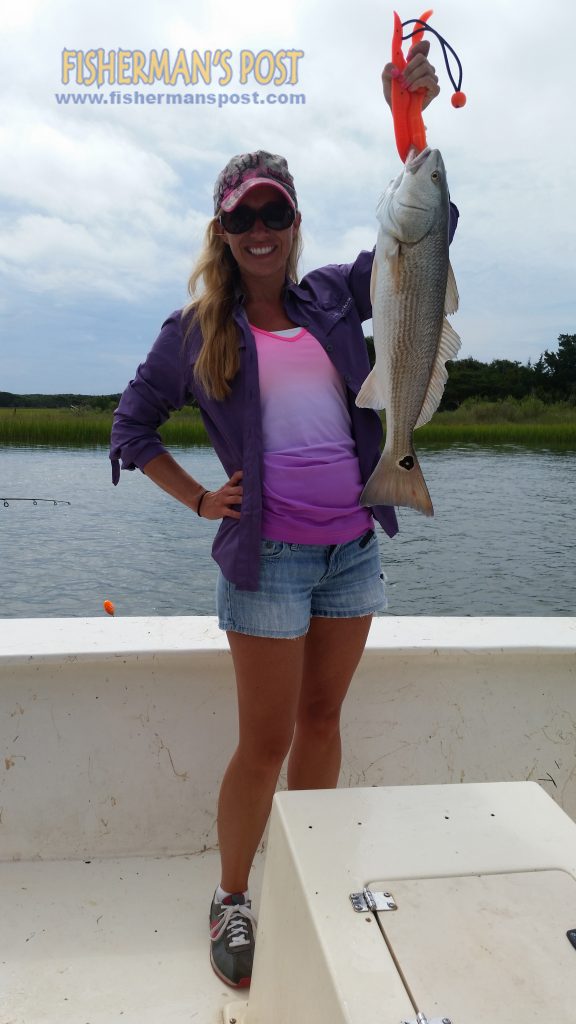 Amanda Sheets, of Jacksonville, NC, with a 25" red drum she landedafter it struck a live finger mullet while she was fishing near Browns Inlet with Capt. Ricky Kellum of Speckled Specialist Charters.