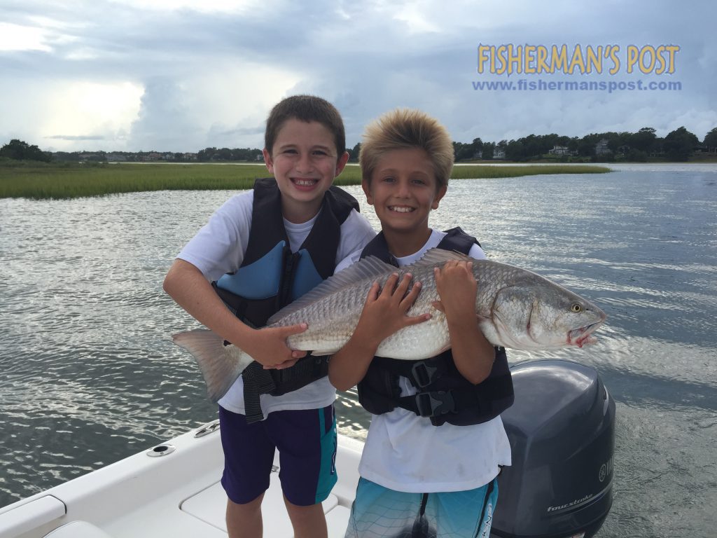 Barrett Angel and Fisher Williams (both 10), of Wilmington, with a 36" red drum they caught and released inshore of Wrightsville Beach after it struck a live mullet.