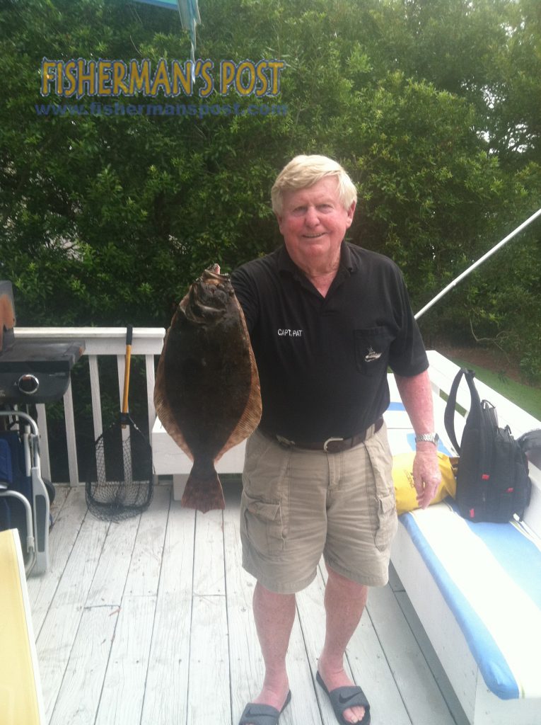 Capt. Pat Stone, of GA, with a 20" flounder that bit a live finger mullet off a Bradley Creek dock while he was fishing with Steve Campbell.