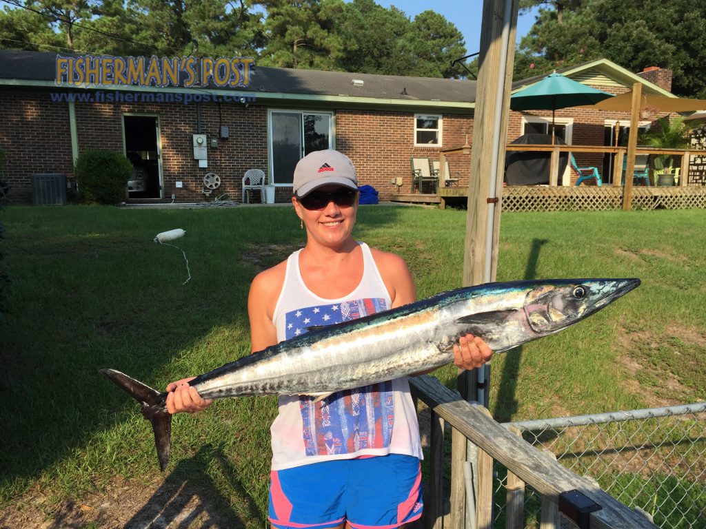 Anya Folger, of Wilmington, with her first wahoo, hooked on a ballyhoo under a purple/black jethead while she was trolling in 450' of water near the Same Ol' Hole on the "HOTSAM."