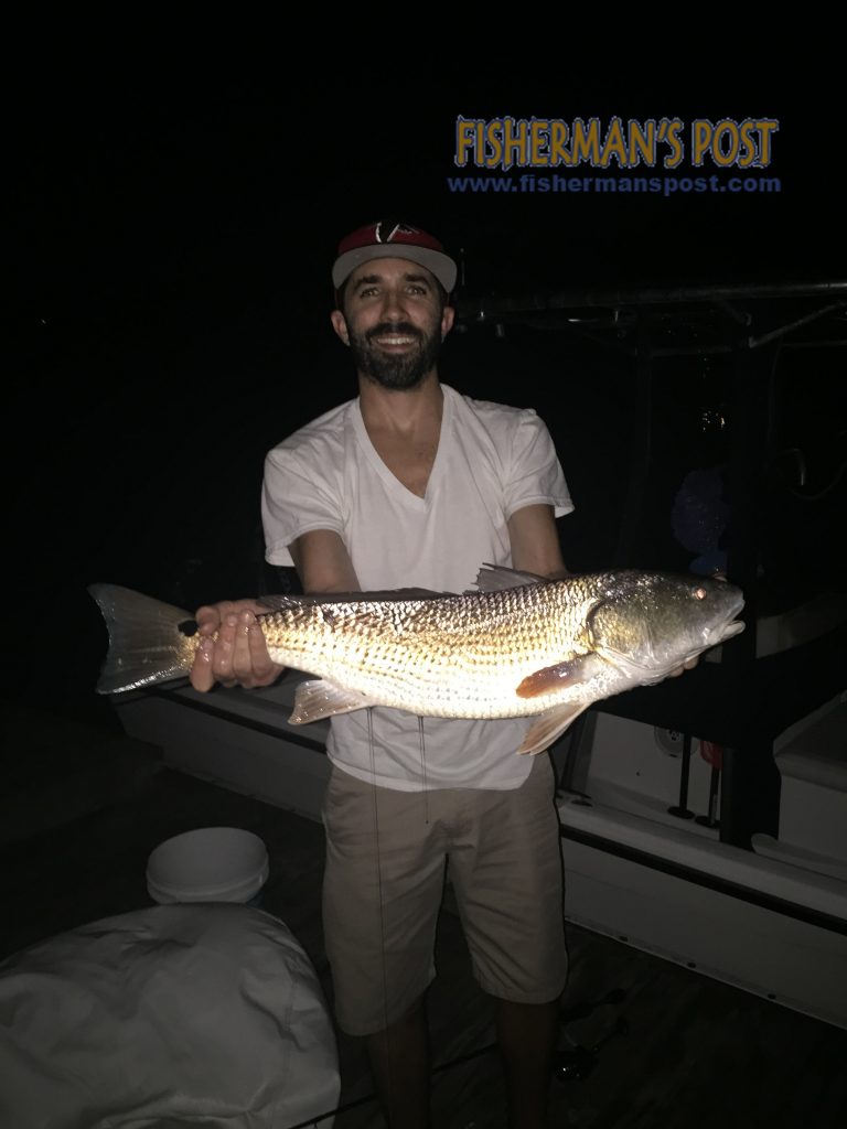 Philip Rainwater, of Altanta, GA, with a 26" red drum that struck a cut bait in Howe Creek.