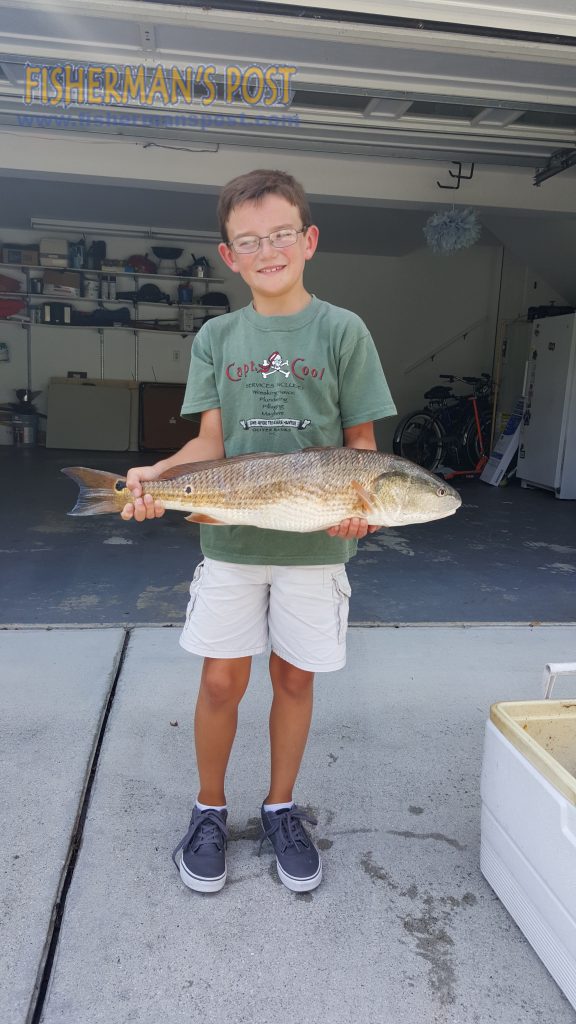 Parker Smith with an upper-slot red drum that engulfed a live mullet while he was fishing with his father in Carolina Beach Inlet.