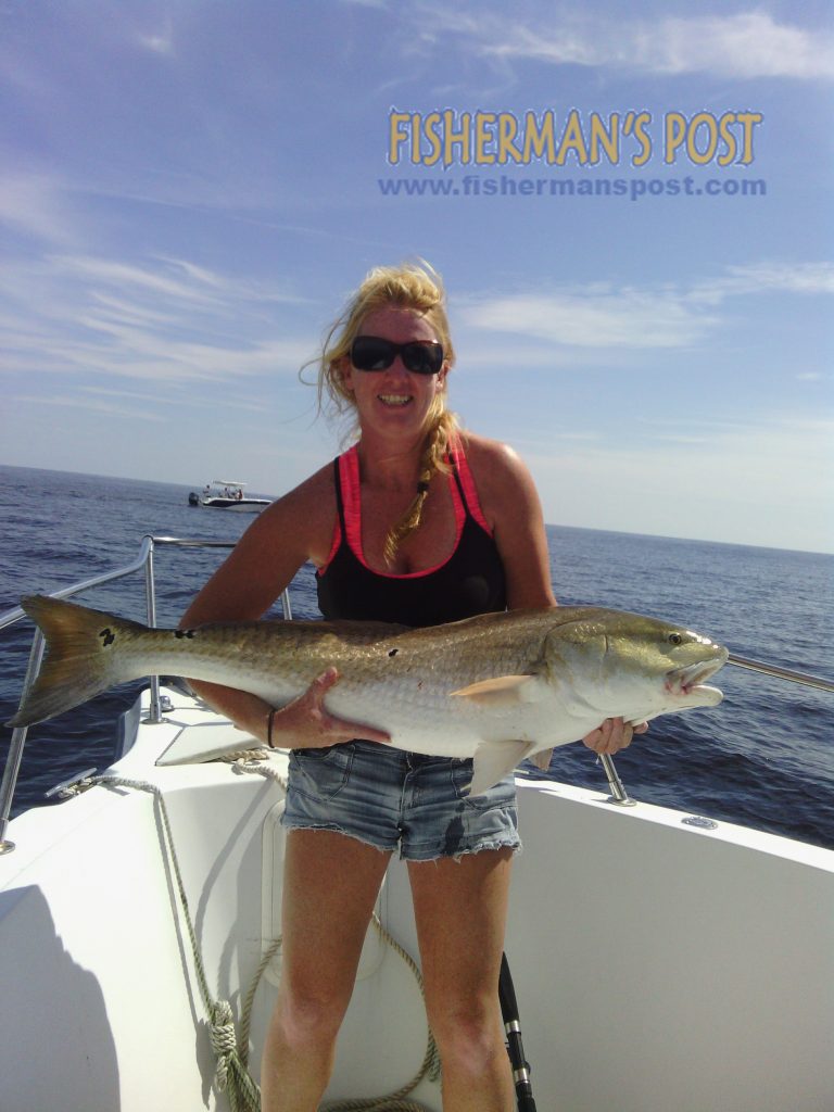 Capt. Amanda King, of Second Wind Charters, with a well over-slot red drum she caught and released just off Lockwood Folly Inlet.