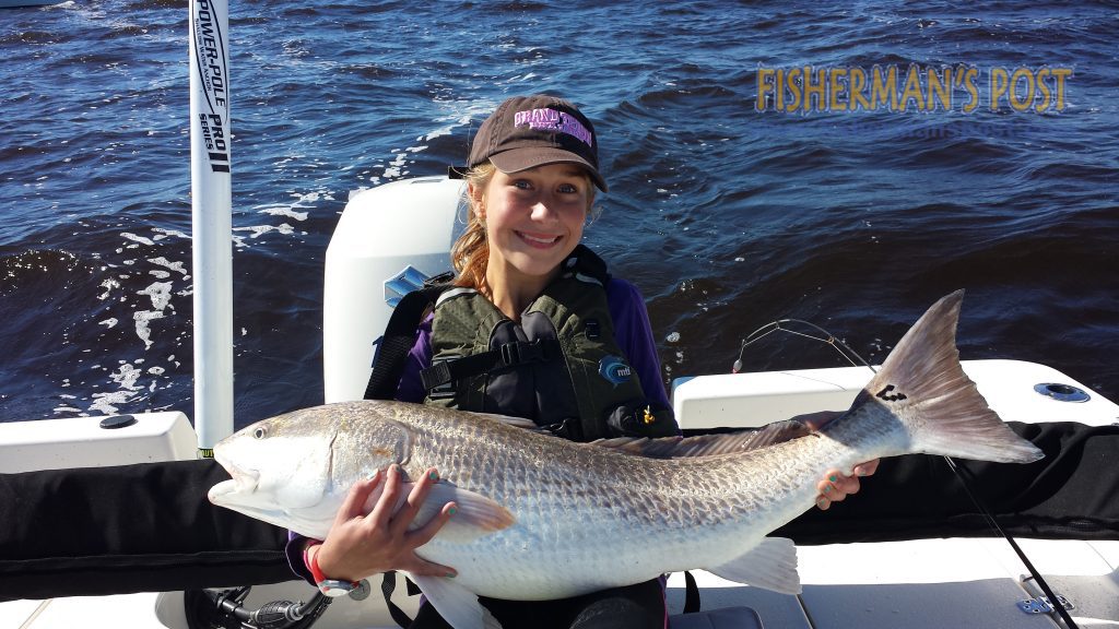 Taylor Snider, of Denton, NC, with a 38" red drum that attacked a piece of cut mullet near Yaupon Reef.