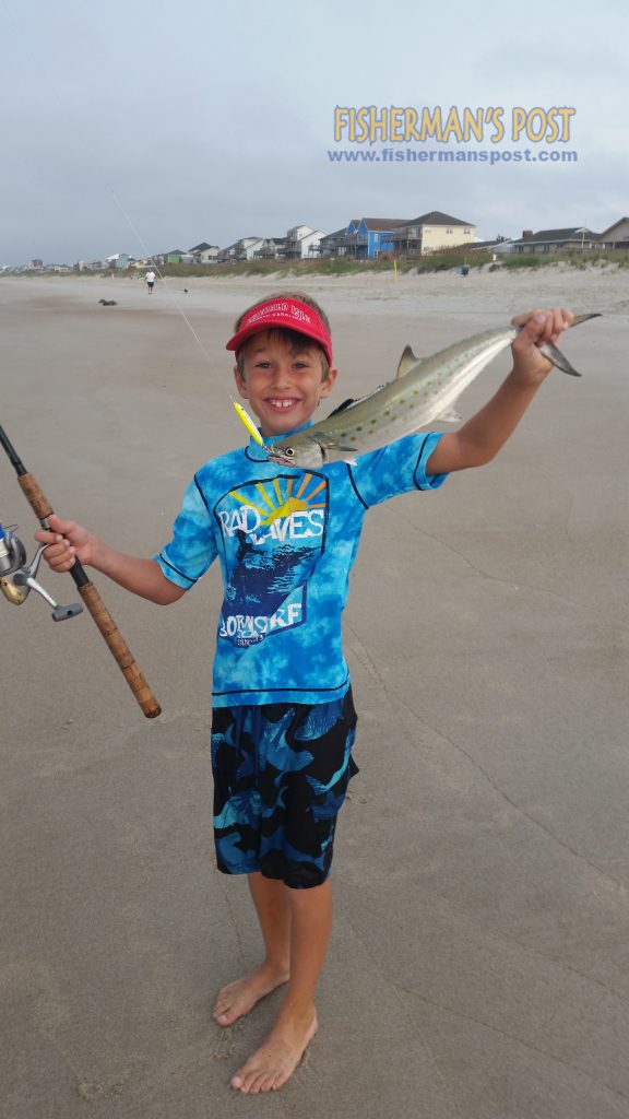 James McCargo (age 8) with a spanish mackerel that bit a metal jig in the surf at Emerald Isle while he was fishing with his father.