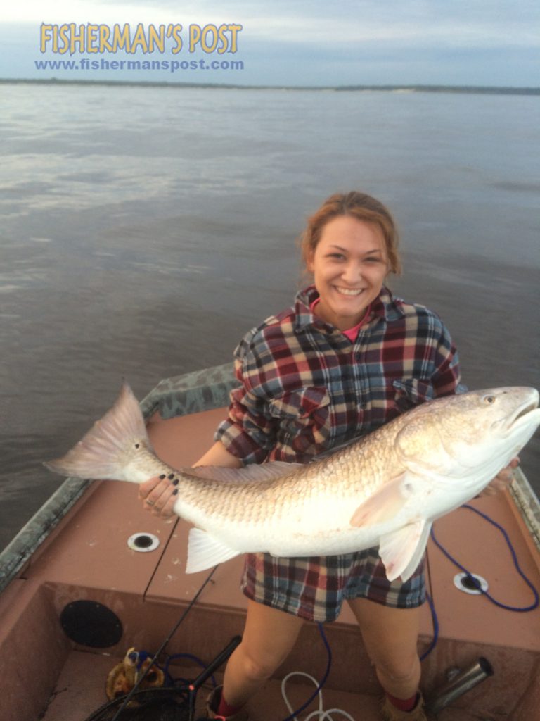 Danielle Wilson with her first red drum, hooked on a live menhaden in Little River Inlet.