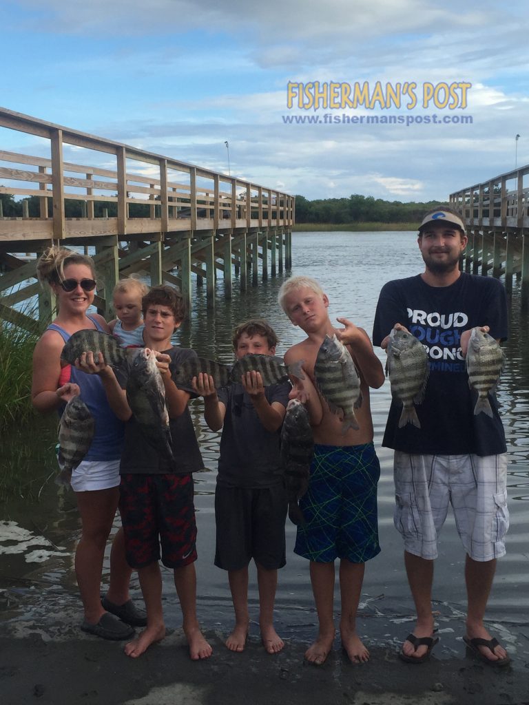 Hollie Gore, Sadie Nihoa, Alex and Dylan Stone, Connor Yates, and Devon Kendrick with black drum and sheepshead they hooked while fishing an Ocean Isle dock with live fiddler crabs.