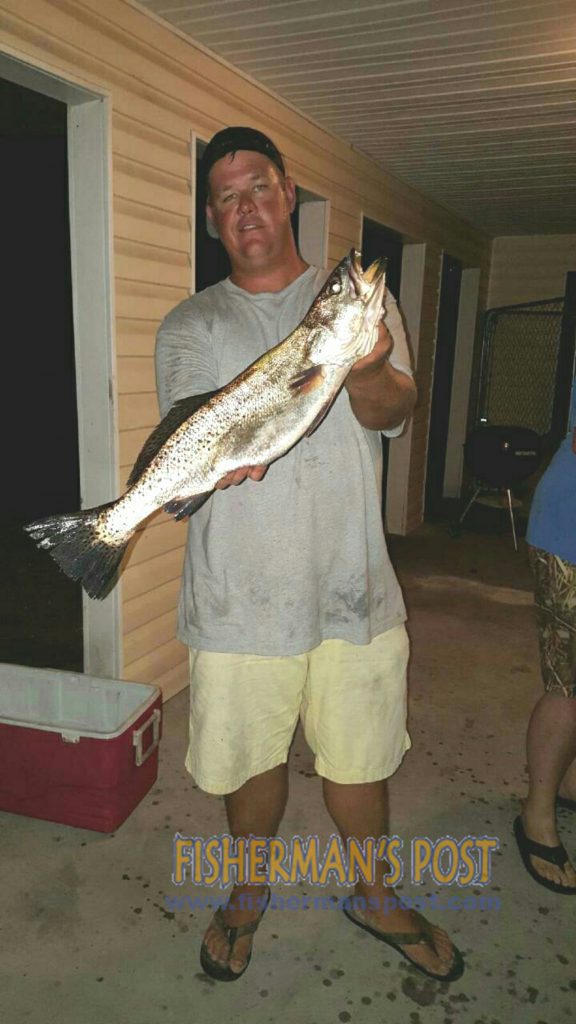 Kyle Peters with a 5.6 lb., 24" speckled trout he hooked on a live finger mullet while fishing near Bald Head Island.