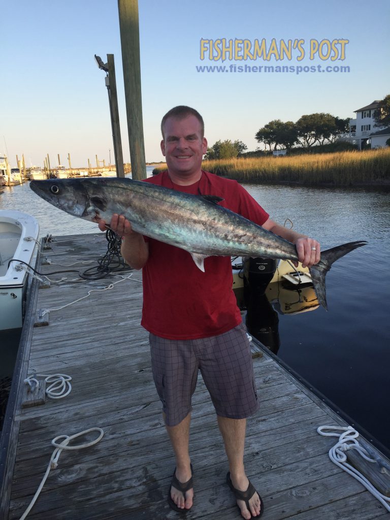 Ryan Murray, of Wilmington, NC, with his first king mackerel, hooked on a pink Pirate Plug with a cigar minnow while he was trolling just off Carolina Beach.