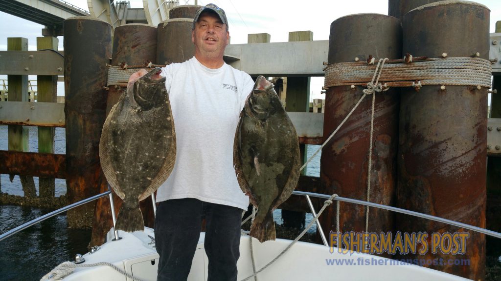 Tim Rudder, of Chasin' Tails Outdoors, with 5.5 and 6.5 lb. flounder that he hooked on live finger mullet while fishing near the railroad trestle at Radio Island.